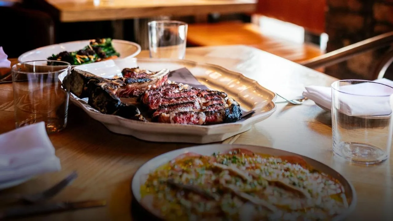 a table with a plate of food and a plate of food at Parador 44 in Cardiff
